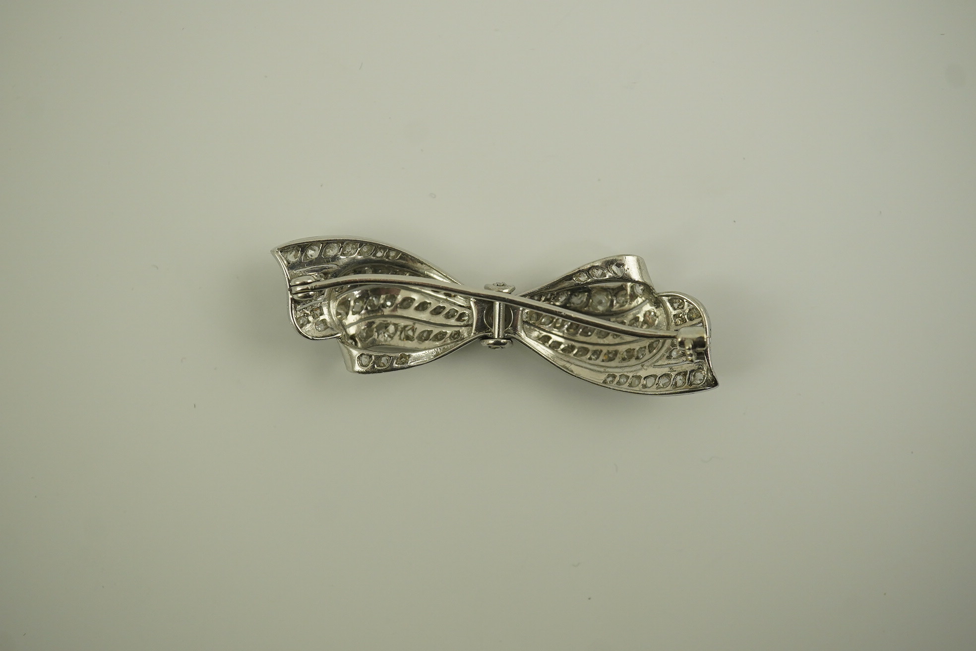 A 1940's platinum? and diamond cluster set ribbon bow brooch